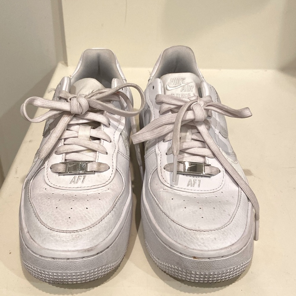 Nike Air AF1 white leather sneaker .